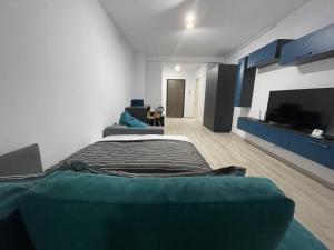 Un pat sau paturi într-o cameră la Moghioros Park Residence DUM4