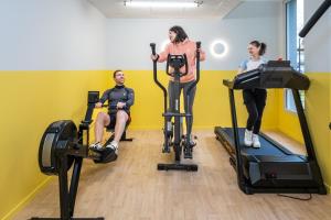 a group of people in a gym with exercise bikes at Résidence Kley Angers in Angers