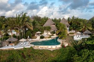 an aerial view of a resort with a swimming pool at Msambweni Beach House and Private Villas in Msambweni