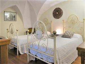 Postel nebo postele na pokoji v ubytování Casetta Rubichi Apartment