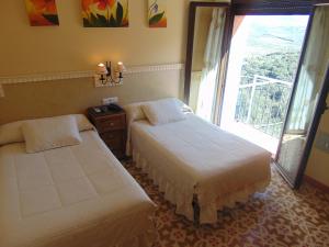 Postel nebo postele na pokoji v ubytování Hotel Sierra de Araceli Lucena