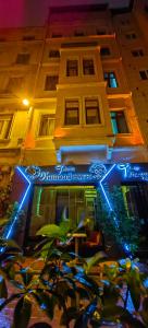 a building with a blue sign in front of it at taksim diamond hotel in Istanbul