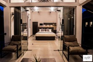 Voodi või voodid majutusasutuse Karawwa Luxury Villas toas