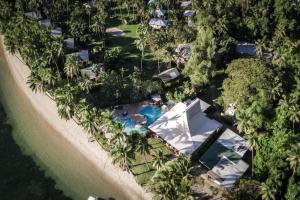 an aerial view of a resort with a pool and trees at Beqa Lagoon Resort in Beqa Island