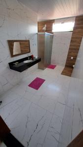 En eller flere senge i et værelse på Pousada Valentina