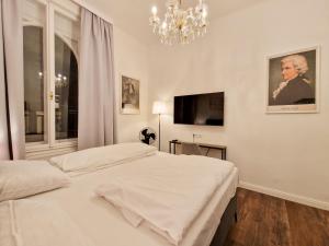 Ένα ή περισσότερα κρεβάτια σε δωμάτιο στο Pension Mozart - Newly Renovated