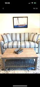 a living room with a couch and a coffee table at Sapphire Beach Resort and Marina in East End