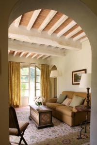 a living room with a couch and a table at Villa Valle, Villa Saletta Wine Estate in Forcoli +48 photos