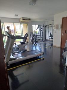 a gym with several tread machines in a room at Lindo Flat em resort silencioso e aconchegante in Brasilia +15 photos
