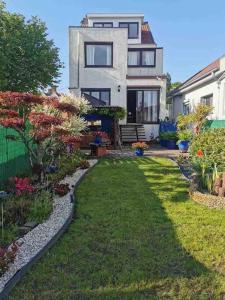 a house with a garden in front of it at Spacious Villa in Dilbeek with Private Garden, Ideal for Families & Business in Dilbeek