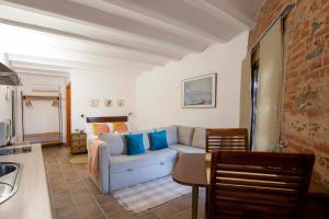 Posedenie v ubytovaní Apartamentos Turísticos Lobelia Suites