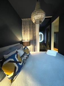 a bedroom with a large bed and a lamp at Luxury Stay Vienna in Vienna