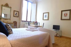 Un ou plusieurs lits dans un hébergement de l'établissement Appartamento Vellutini