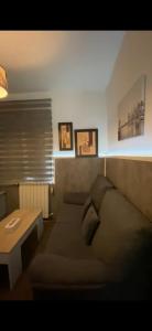 a living room with a bed and a table at Calle la cadena 23 varea, Logroño in Logroño