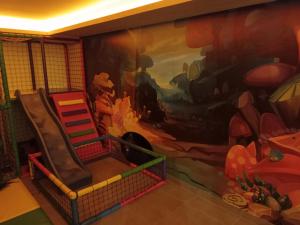 a mural of a car on the wall in a room at Milmari N Lux 52 in Kopaonik