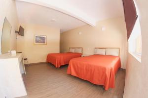Postel nebo postele na pokoji v ubytování Hotel Camino de Piedra