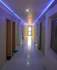 a hallway of a hospital with a blue light at Andalusia Hotel in Nouakchott