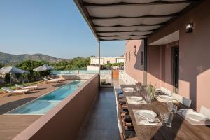 an outdoor dining area of a house with a swimming pool at Villa Enny, 3 BD with Private Heated Pool in Ayiá