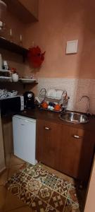 a kitchen with a sink and a counter top at Casa Rosy.S in Pozzuoli