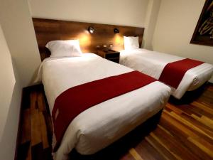Postel nebo postele na pokoji v ubytování Zans Apartments Cusco