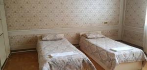 Postel nebo postele na pokoji v ubytování Royal Boutique Hotel on Kievyan