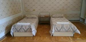 Postel nebo postele na pokoji v ubytování Royal Boutique Hotel on Kievyan