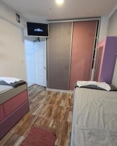 Una cama o camas en una habitación de Apartamento suite en capital