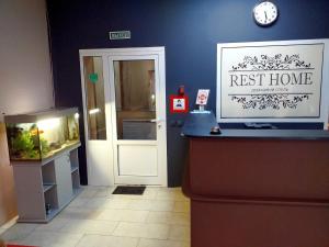 a restaurant with a fish tank next to a door at Rest Home Hotel in Nizhny Novgorod
