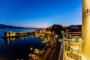 a balcony with a view of a body of water at Vip Lepanto Port Suites in Nafpaktos