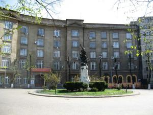 a statue in front of a large building at Park View Bucharest in Bucharest