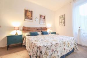 A bed or beds in a room at Casa Giovanetti