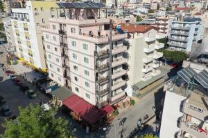 an overhead view of a large white building on a city street at Vesta Apart Hotel in Kuşadası
