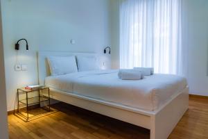 Postel nebo postele na pokoji v ubytování Acropolis museum residence