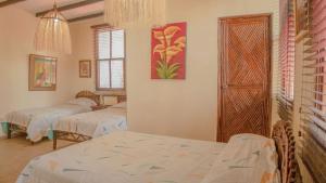 Llit o llits en una habitació de Hostería Ecológica El Faro