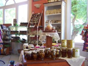 a store with jars on a table in a room at Karin & Nikos in Ireon