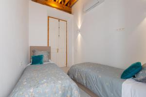 Posteľ alebo postele v izbe v ubytovaní Wonderful apartment with three bedrooms and two bathrooms in the center