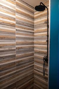 a bathroom with a shower with a glass door at logement entier au calme in Étercy