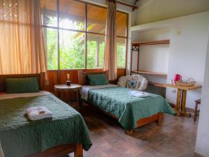 Postel nebo postele na pokoji v ubytování Wandari Lodge