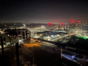 a view of a city at night with red lights at Stunning Lake and City View 2BD/2BA in Kent