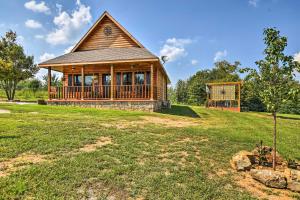 a house on a hill with a large yard at Hot Springs Cabin Rental 2 Mi to Lake Hamilton! in Hot Springs