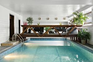 a swimming pool in the middle of a building at Best Western Hotel Arctic Eden in Kiruna