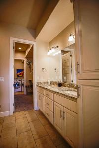 a bathroom with a sink and a large mirror at Coral Ridge 4266 Desert Retreat in Washington