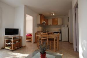 a living room with a kitchen and a dining room at Cottage in Lagorce in Lagorce