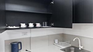 Kuchyň nebo kuchyňský kout v ubytování Maria Cristesa Condotel