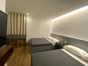 Un pat sau paturi într-o cameră la Espineli's
