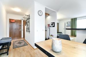 a living room with a table and a dining room at Ferienwohnung in der Sonnenstadt Lienz in Lienz
