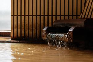 a water pipe on the floor of a building at KAMENOI HOTEL Arima in Kobe