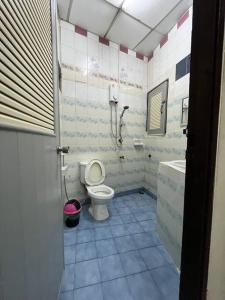 a bathroom with a toilet and a sink at Room101 in Wanna Apartment in Pattaya Central