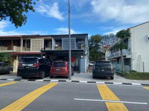 a parking lot with cars parked in front of a building at TOWN 13Px 5R4B V KIDS POOL & KTV & JACCUZI SPA & POOL TABLE NEAR USM & LAM WAH EE HOSPITAL & HAN CHIANG HIGH SCHOOL in Gelugor