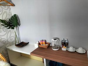 a counter with a basket of food on top of it at D Elegance Hotel in Nusajaya